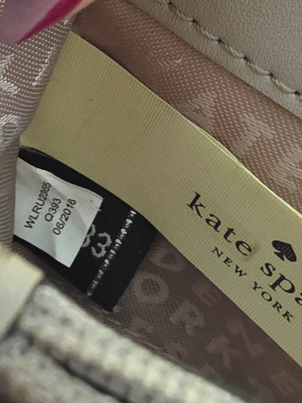 kate spade Rose Gold Zip-around wallet with gold plaque